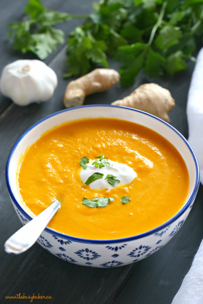 carrot soup recipe in a bowl with herbs