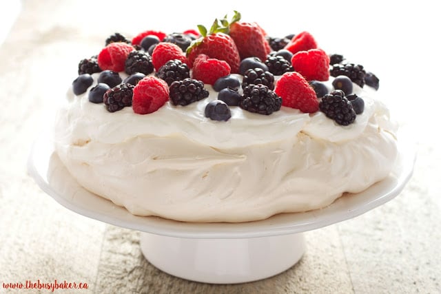 The Perfect Pavlova recipe makes a delicious and showstopping easy-to-make gluten-free dessert that's also on the healthier side! Recipe from thebusybaker.ca!