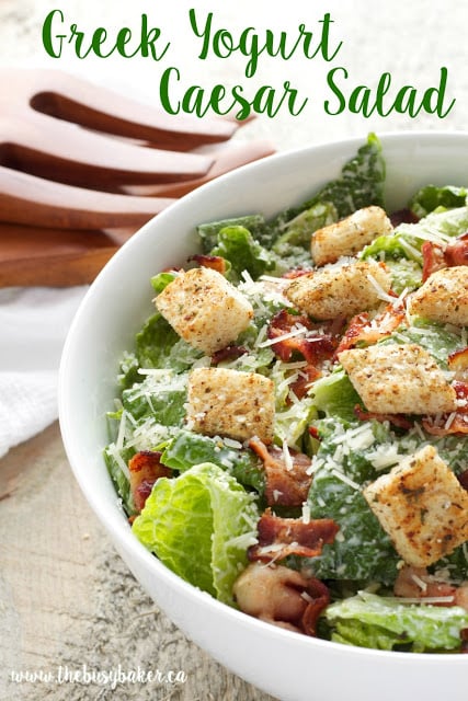 This Greek Yogurt Caesar Salad is a healthy and low fat alternative to traditional Caesar salad! It's ultra creamy and delicious and it's so easy to make! Recipe from thebusybaker.ca!