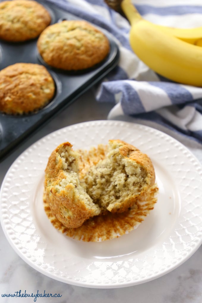 These Best Ever Banana Muffins are the best banana muffins you'll ever try - crispy on the outside and fluffy on the inside! And so easy to make in only one bowl! Ready in minutes! Recipe from thebusybaker.ca! #besteverbananamuffins #bestbananamuffins #bananamuffins #easymuffinrecipe