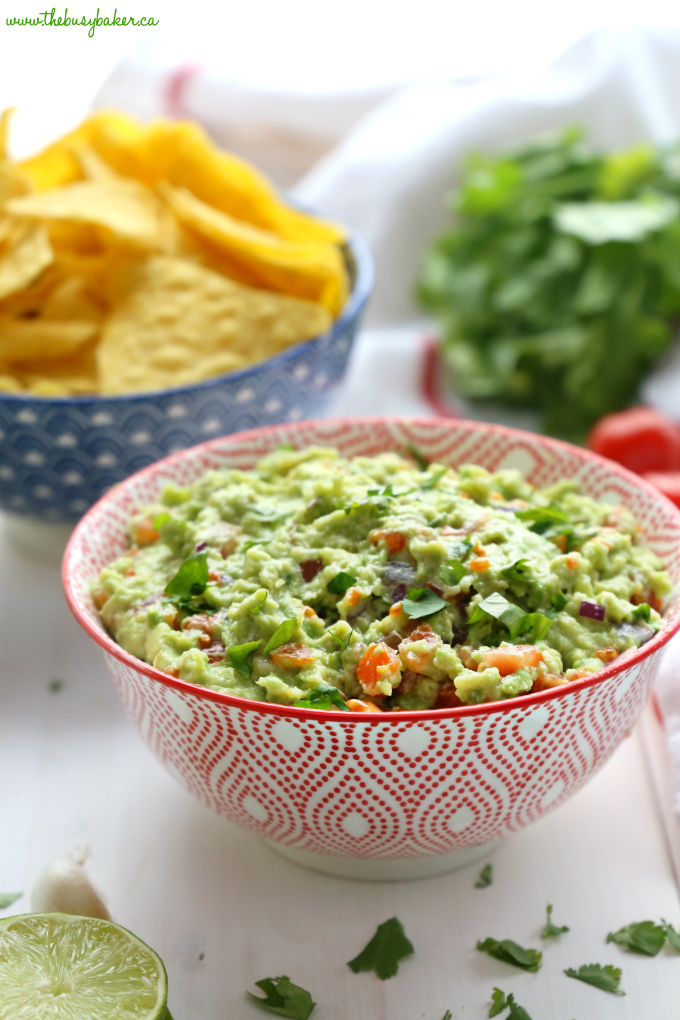 Best Ever Healthy Guacamole with avocados, tomatoes, red onions and cilantro