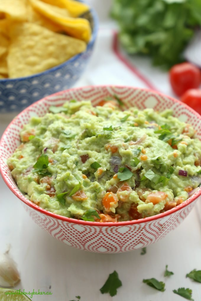 Best Ever Healthy Guacamole with fresh ingredients and tomatoes