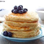 stack of healthy buttermilk pancakes with fresh blueberries