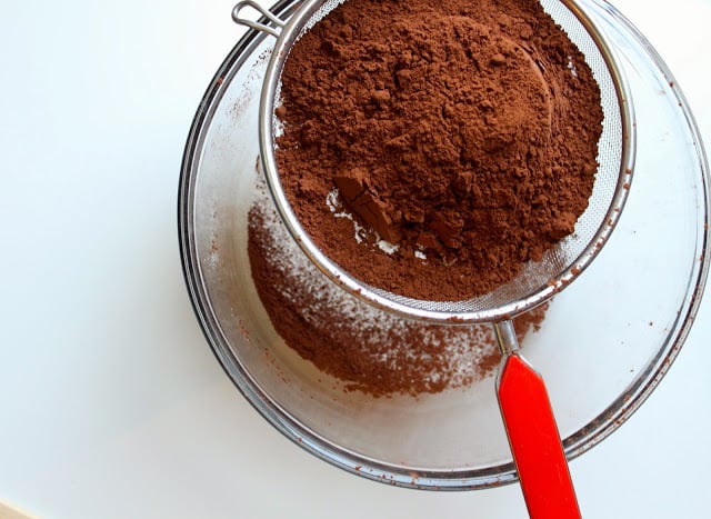 sifting cocoa powder and flour into a bowl