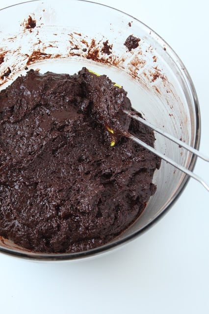 making chocolate cake batter in a bowl