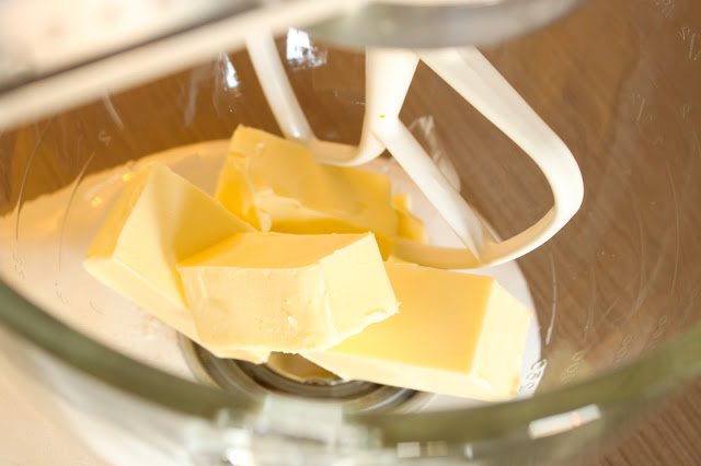 sticks of butter in the bowl of an electric stand mixer
