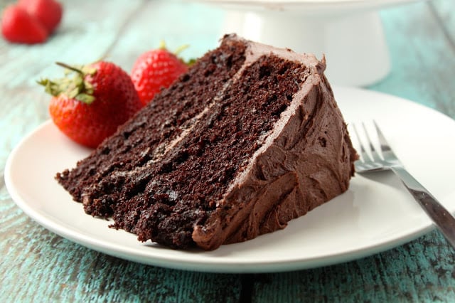 slice of chocolate layer cake with chocolate frosting