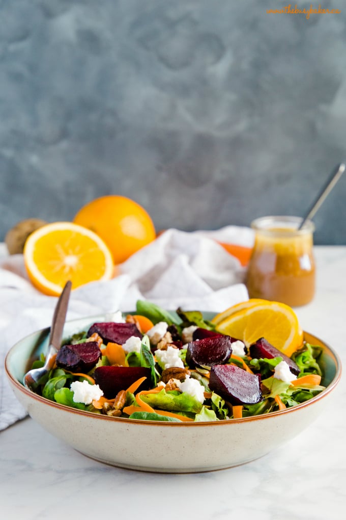 a bowl of salad with roasted and goat cheese