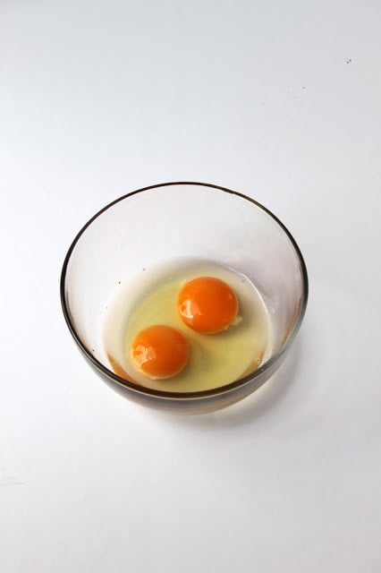 2 eggs cracked into a bowl