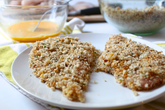 chicken breasts coated with seasoned bread crumbs