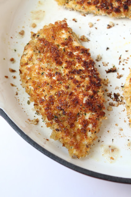 cooking chicken Milanese in a frying pan