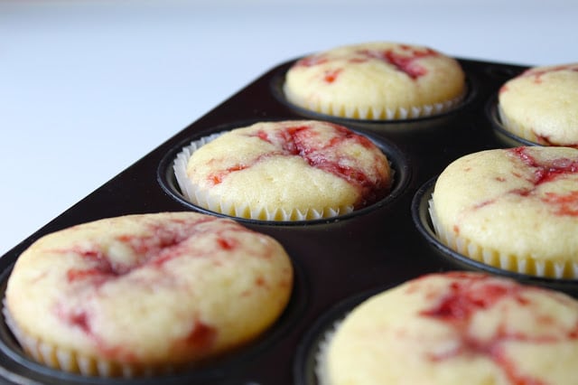 Strawberry Cupcakes with Fresh Strawberry Buttercream are the perfect summer dessert, packed with fresh strawberries. You'll love this easy cupcakes recipe! #cupcakes #recipe #strawberries #desserts strawberry cupcakes baked in a cupcake pan