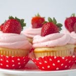 platter of strawberry cupcakes with strawberry buttercream frosting