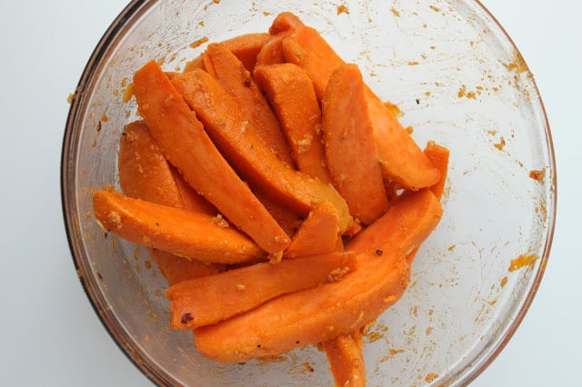 boiled sweet potato wedges tossed with seasoning