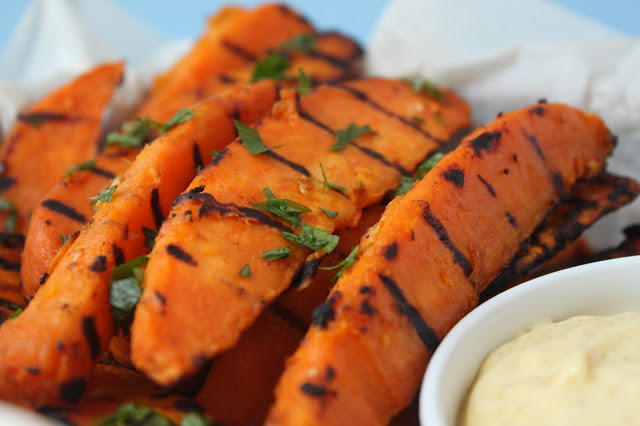 grilled sweet potato wedges garnished with fresh parsley