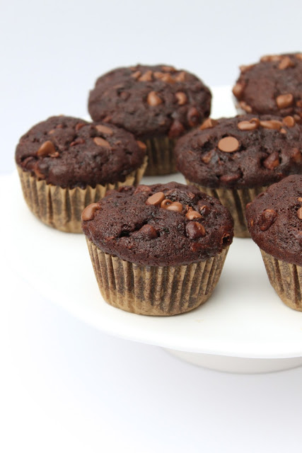 These healthier Double Chocolate Zucchini Muffins are packed with veggies and they're a more wholesome way to satisfy your chocolate cravings! Recipe from thebusybaker.ca!