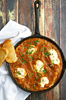 http://www.thewickednoodle.com/baked-eggs-recipe-in-tomato-chipotle-sauce/