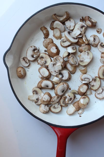 fresh cremini mushrooms in a skillet