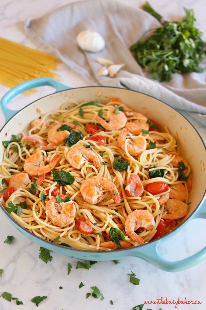 This Easy Healthy Shrimp Scampi is a delicious and healthy weeknight meat featuring fresh shrimp, pasta and veggies in a light-tasting garlic cream sauce! Recipe from thebusybaker.ca! #shrimpscampi #easyshrimppasta #healthyshrimppasta #healthyshrimpscampi 