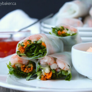 shrimp and vegetable spring rolls with a side of creamy sriracha dipping sauce