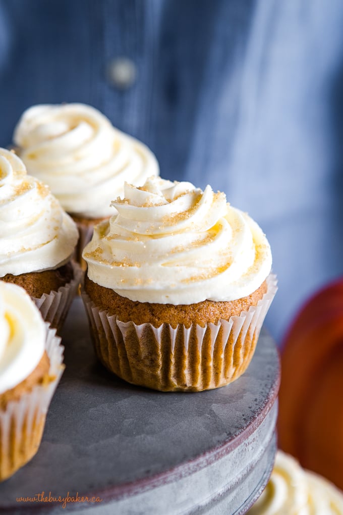 pumpkin spice cupcakes on metal cake stand