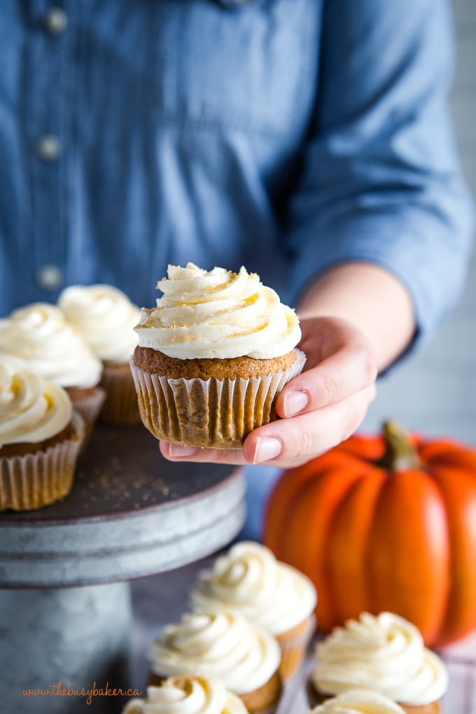 pumpkin spice cupcake in hand