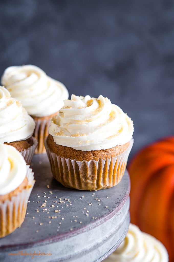 Pumpkin spice cupcakes on galvanized metal cake stand