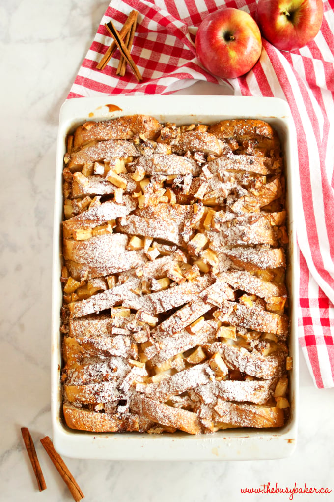 This Apple Cinnamon French Toast Casserole is the perfect holiday breakfast entertaining recipe made with fresh apples, pecans, and served with maple syrup! Recipe from thebusybaker.ca! #holidaybreakfastrecipe #holidayrecipe 