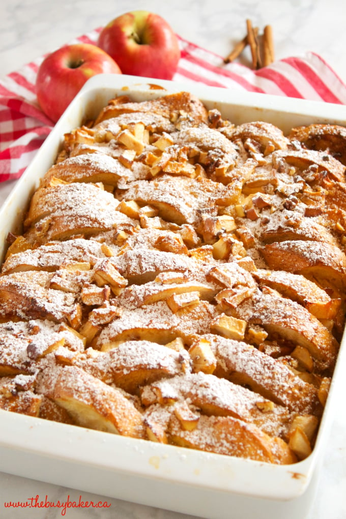 This Apple Cinnamon French Toast Casserole is the perfect holiday breakfast entertaining recipe made with fresh apples, pecans, and served with maple syrup! Recipe from thebusybaker.ca! #holidaybreakfastrecipe #holidayrecipe 