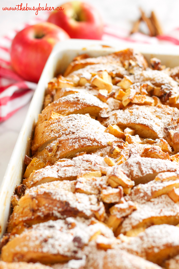 This Apple Cinnamon French Toast Casserole is the perfect holiday breakfast entertaining recipe made with fresh apples, pecans, and served with maple syrup! Recipe from thebusybaker.ca! #holidaybreakfastrecipe #holidayrecipe 