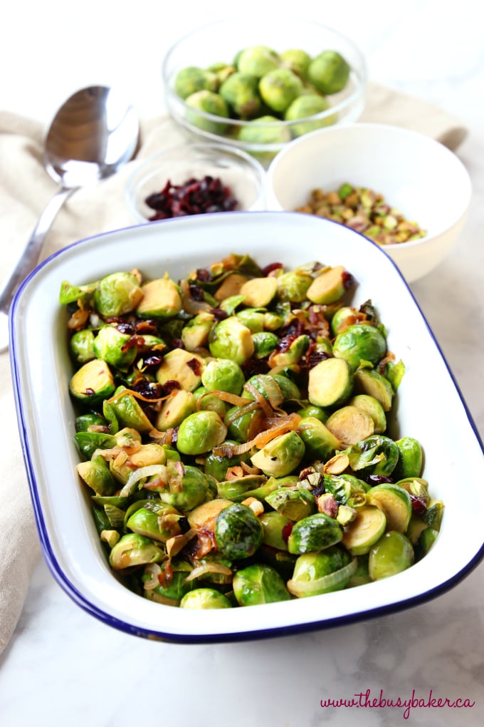 These Brussels Sprouts with Caramelized Onions, Cranberries and Pistachios make the perfect holiday side dish recipe! They're sweet and full of flavour, and they're a colourful, healthy choice! Recipe from thebusybaker.ca! #healthysidedish #healthyholidayrecipe #healthychristmas #christmassidedish #brusselssprouts #healthybrusselssprouts
