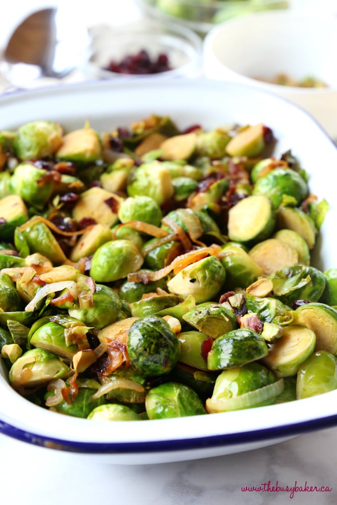 These Brussels Sprouts with Caramelized Onions, Cranberries and Pistachios make the perfect holiday side dish recipe! They're sweet and full of flavour, and they're a colourful, healthy choice! Recipe from thebusybaker.ca! #healthysidedish #healthyholidayrecipe #healthychristmas #christmassidedish #brusselssprouts #healthybrusselssprouts