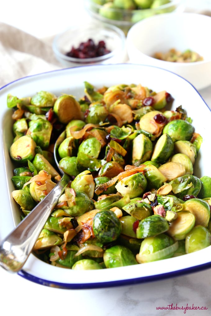 These Brussels Sprouts with Caramelized Onions, Cranberries and Pistachios make the perfect holiday side dish recipe! They're sweet and full of flavour, and they're a colourful, healthy choice! Recipe from thebusybaker.ca! #healthysidedish #healthyholidayrecipe #healthychristmas #christmassidedish #brusselssprouts #healthybrusselssprouts