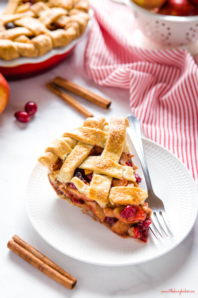 slice of cranberry apple pie with lattice top