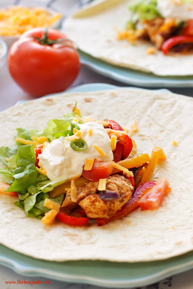 These Easy Oven Baked Chicken Fajitas are the perfect quick and easy weeknight meal! Recipe from www.thebusybaker.ca