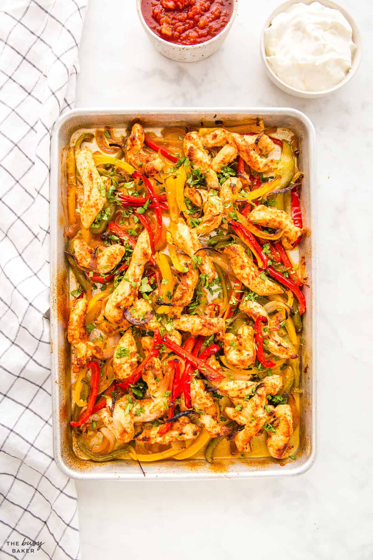 overhead image: chicken fajitas on a sheet pan