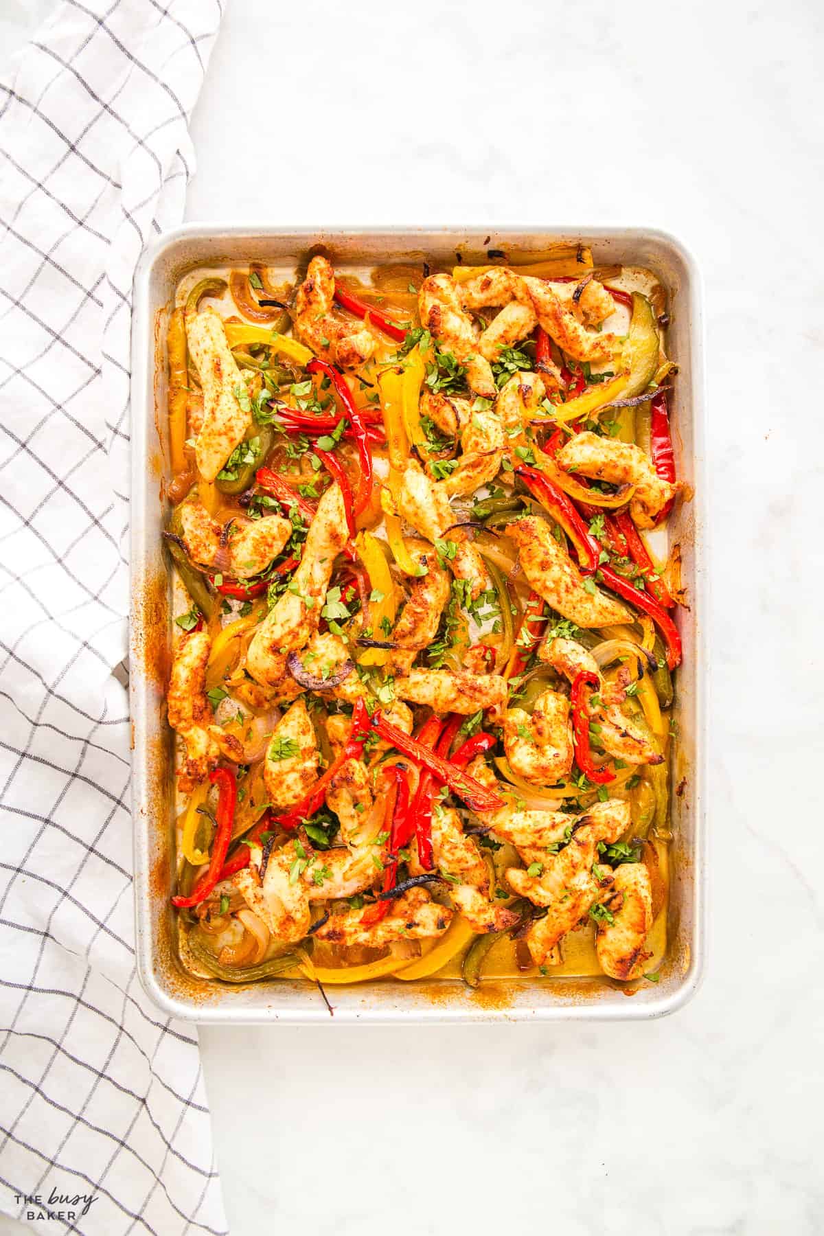 overhead image: sheet pan chicken fajitas filling