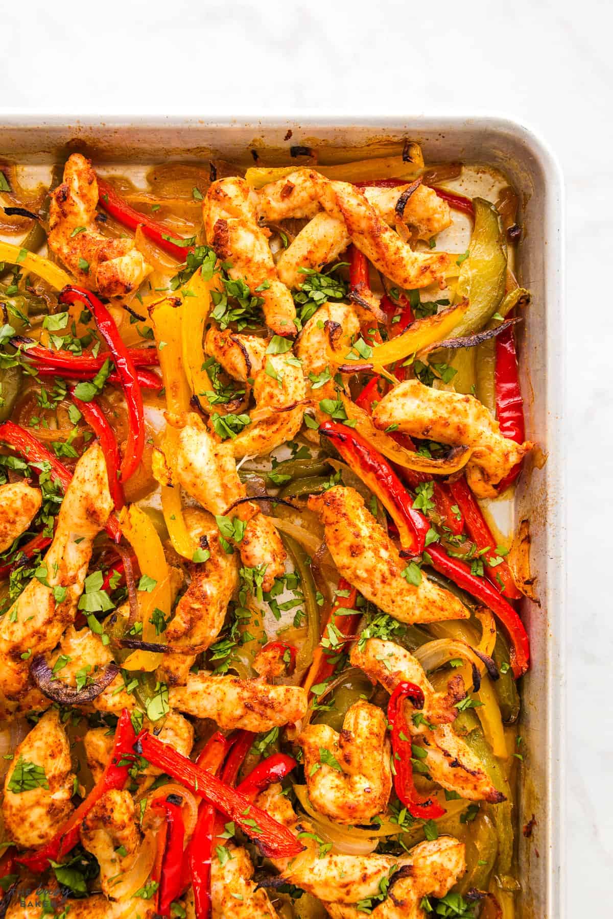 caramelized chicken and peppers on a sheet pan