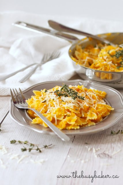 meatless butternut squash pasta dinner on a silver plate with a fork.