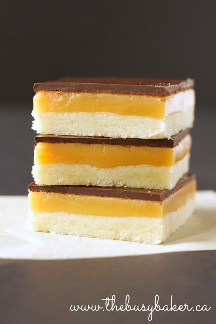 a stack of three homemade chocolate caramel shortbread bars