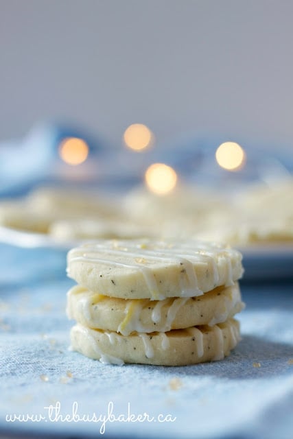 3 buttery lemon shortbread cookies stacked on top of one another