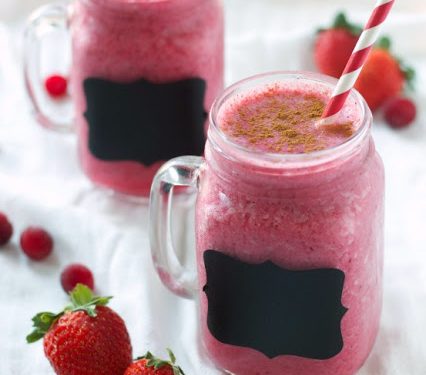 pink smoothie with wild cranberries in mason jar with mint and straw on  wooden background Stock Photo by nblxer