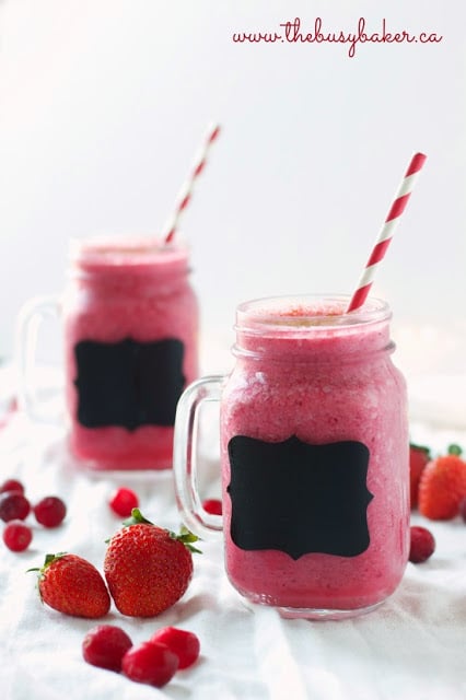 holiday smoothies made with cranberries and strawberries, served in glass mugs with chalkboard tags on the front