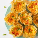 platter of roasted red pepper quiche cups made with phyllo pastry dough