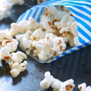 sweet and salty kettle corn in a blue and white striped bag