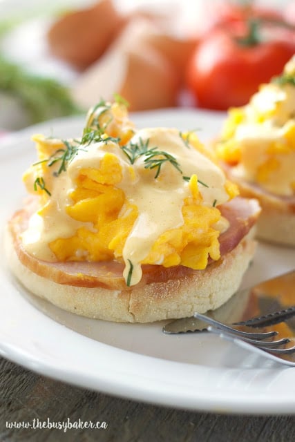 This Skinny Scrambled Eggs Benedict with Low Fat Hollandaise Sauce features Canadian bacon, fluffy scrambled eggs and the creamy low fat Hollandaise sauce! Recipe from thebusybaker.ca!
