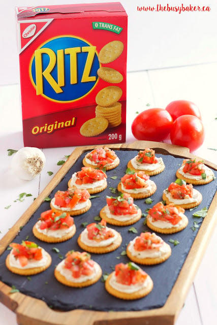 bite-sized bruschetta appetizers served on Ritz crackers