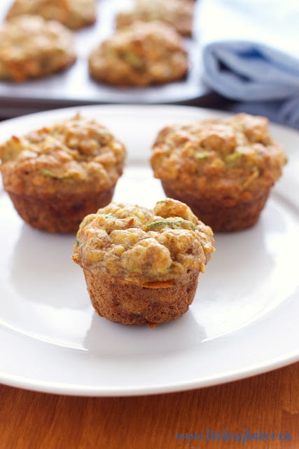 These Healthy Toddler Friendly Mini Muffins are a great snack for kids, sweetened only with fruit and full of vegetables and whole grains! thebusybaker.ca