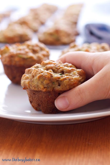 These Healthy Toddler Friendly Mini Muffins are a great snack for kids, sweetened only with fruit and full of vegetables and whole grains! thebusybaker.ca