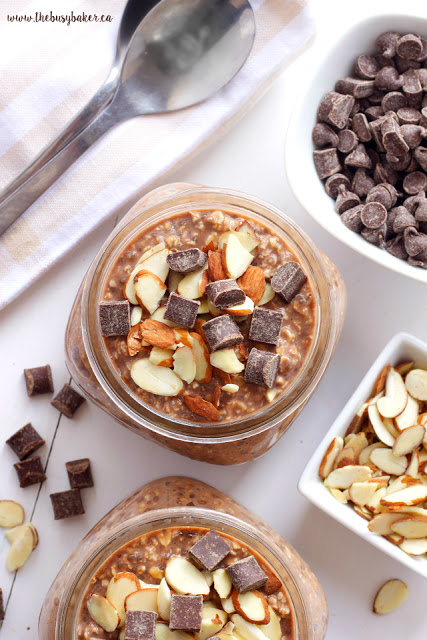 overhead image of chocolate overnight oats garnished with sliced almonds and chocolate